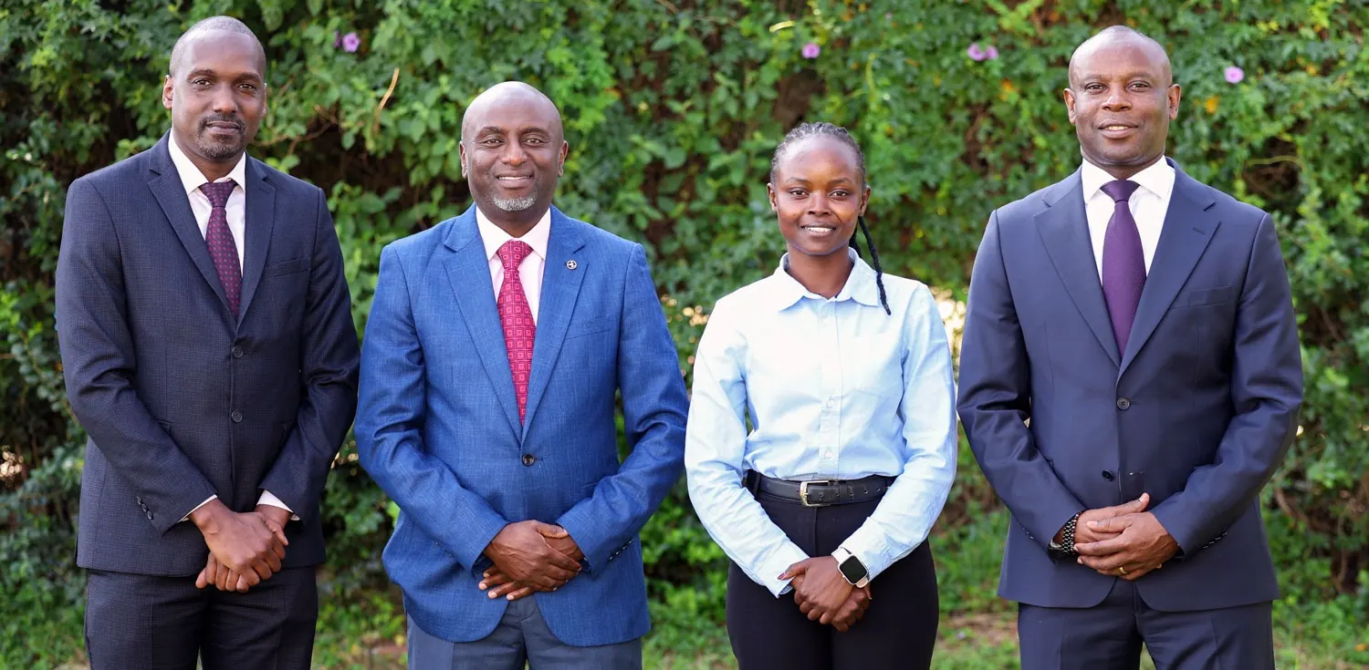 The four members of the Pinebridge team standing together outdoors.